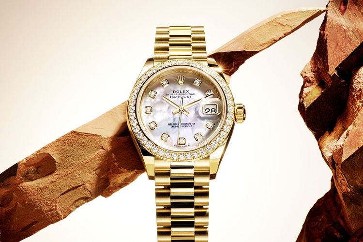 mother of pearl yellow gold set of diamond rolex lady datejust with mountain background