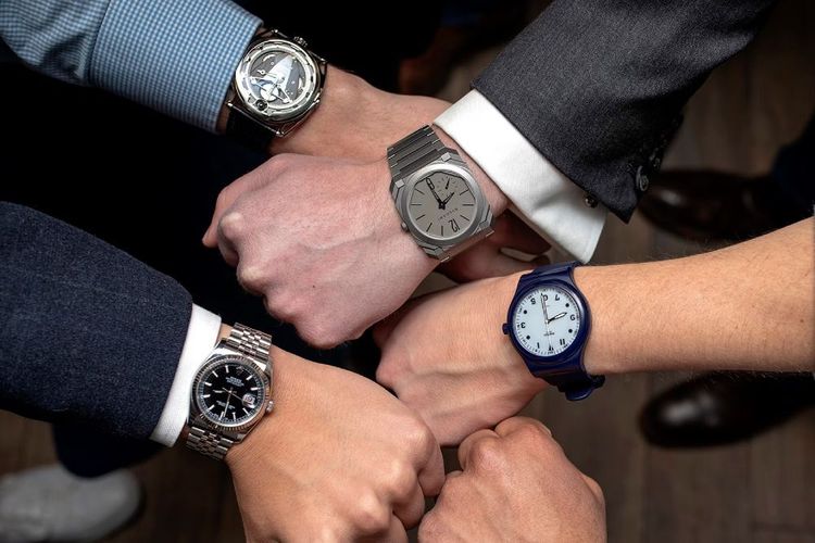 multiple watch models on men's wrists